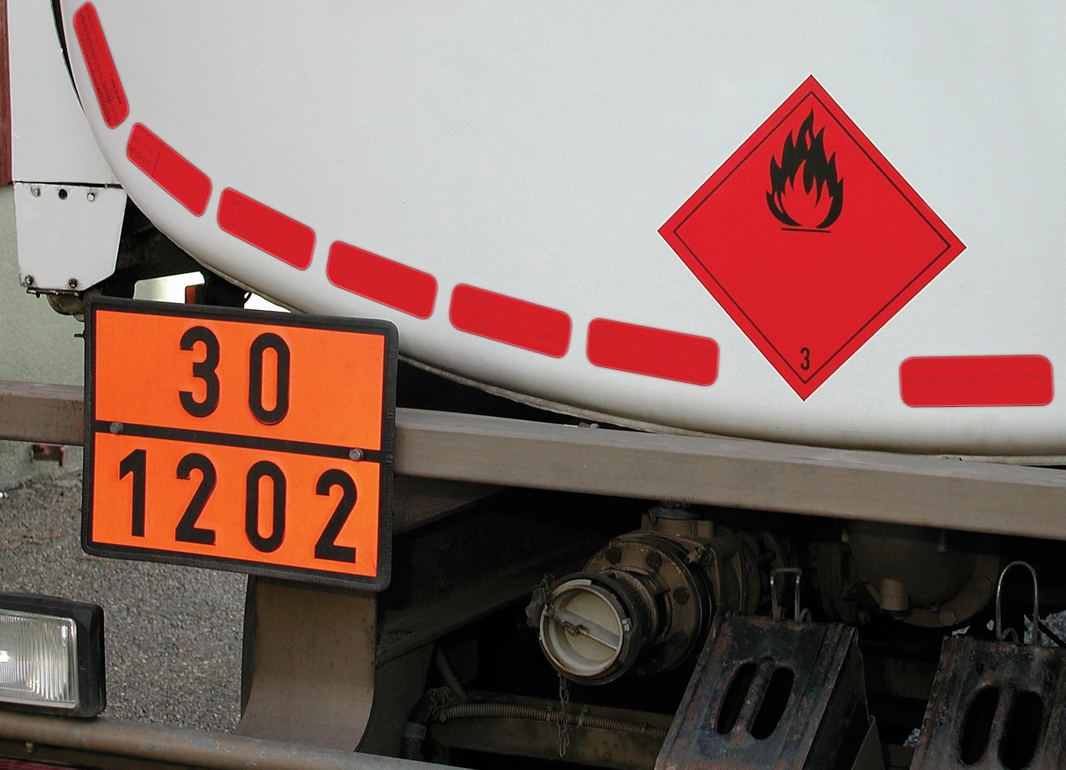 Yellow Conspicuity Tape (Rigid Grade - Segmented for Tankers) - 50 Metre Roll, visible on a diesel tanker, ensuring long-distance visibility with durable, reflective design. Ideal for commercial vehicle safety.