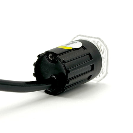 Button Blast LED Warning Lights - Amber (Pair), close-up of black cable, showcasing compatibility with multi-voltage systems and discreet installation for commercial vehicles.