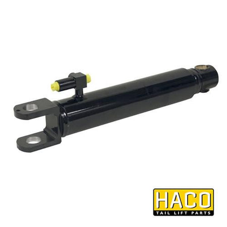 Lift Ram HACO to Suit Bar Cargolift 1WE130849 shown as a black cylinder with a yellow valve, essential for commercial trailer lift systems.