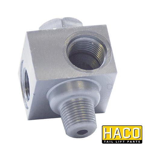 Close-up of a HACO valveblock safety valve compatible with Dhollandia V032, featuring a metal block and screws for tail lift applications.