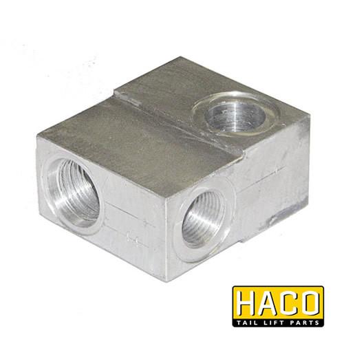 Valveblock safety valve HACO, compatible with Dhollandia V132, featuring a metal block with holes, ideal for large commercial trailers and vehicles.