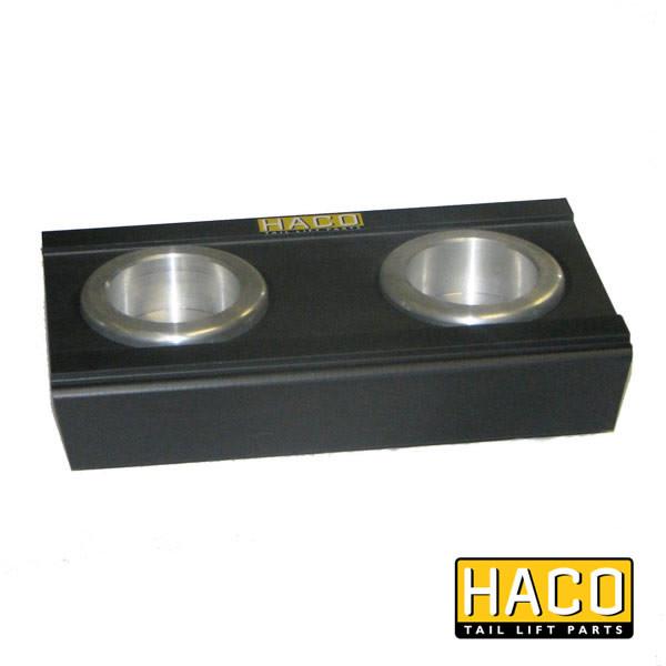 Sliding block >2001 HACO, a black rectangular metal object with two round holes, compatible with Dhollandia M0874, for tail lifts.