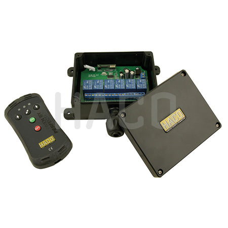 Radio remote control 3-buttons HACO with blue circuit board and a black remote, designed for universal tail lift operations with up, down, and tilt controls.