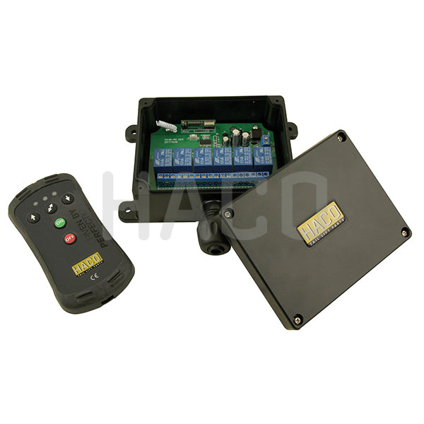 Radio remote control 3-buttons HACO with blue circuit board and a black remote, designed for universal tail lift operations with up, down, and tilt controls.