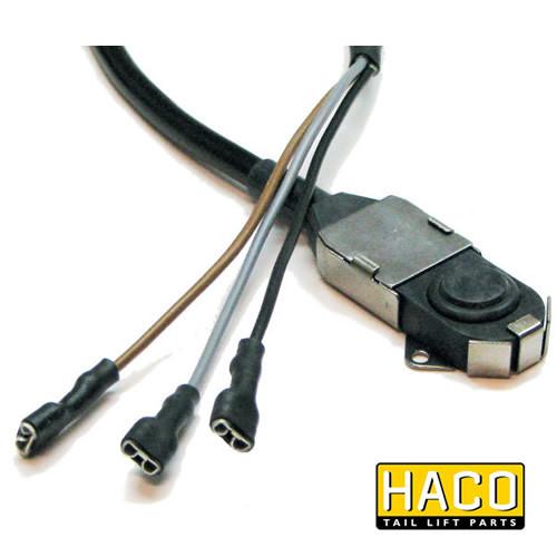 Switch for Footcontrol HACO visible in close-up, featuring multiple wires and a connector, designed to suit MBB Palfinger for commercial vehicle applications.
