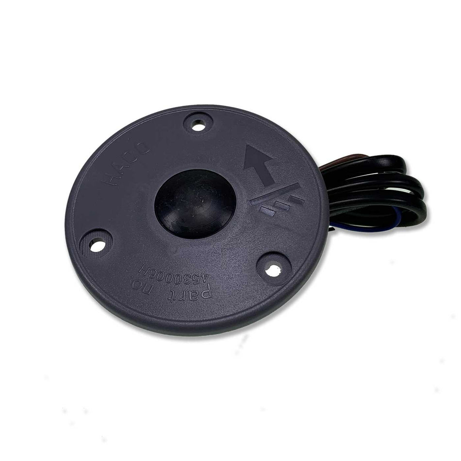 Foot Control Lifting HACO for Anteo Tail Lifts, featuring a round button and electrical wire, designed for large commercial trailers and vehicles.