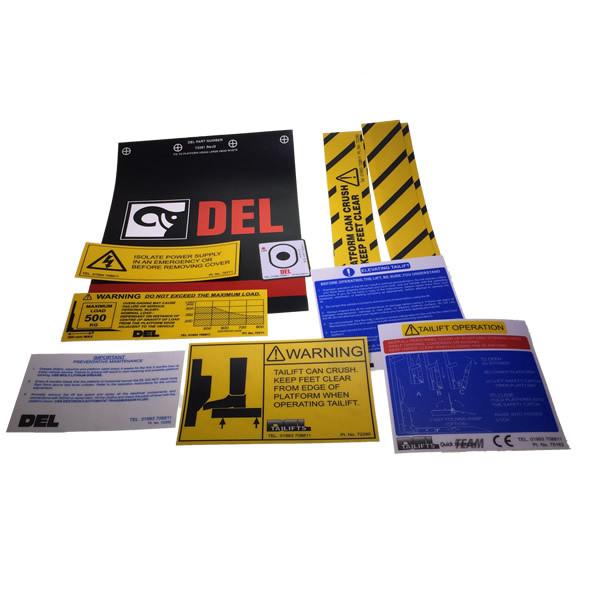 Decal Kit C/W Flags for DL500, featuring various warning and safety stickers, perfect for enhancing visibility and safety on commercial trailers and vehicles.