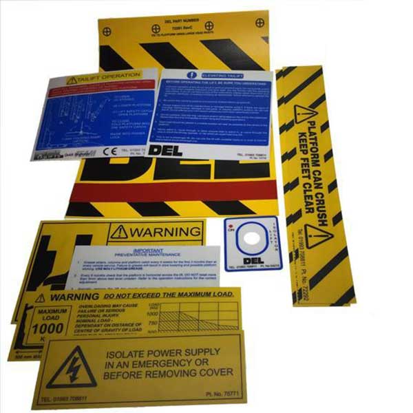 Decal Kit C/W Flags for DL1000, featuring various warning signs and labels, designed for safety on large commercial trailers and vehicles.
