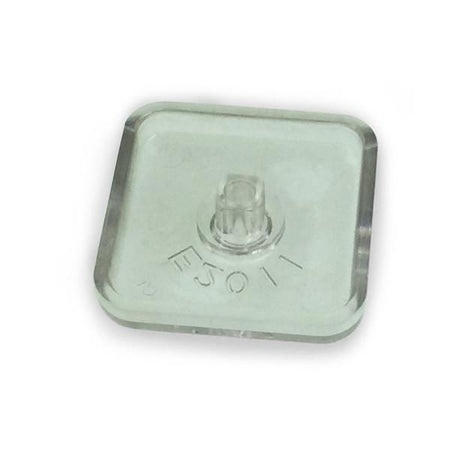 Lens fuse-holder 2008, a clear square object with a small hole, designed for Dhollandia Tail Lifts, essential for large commercial trailer maintenance.