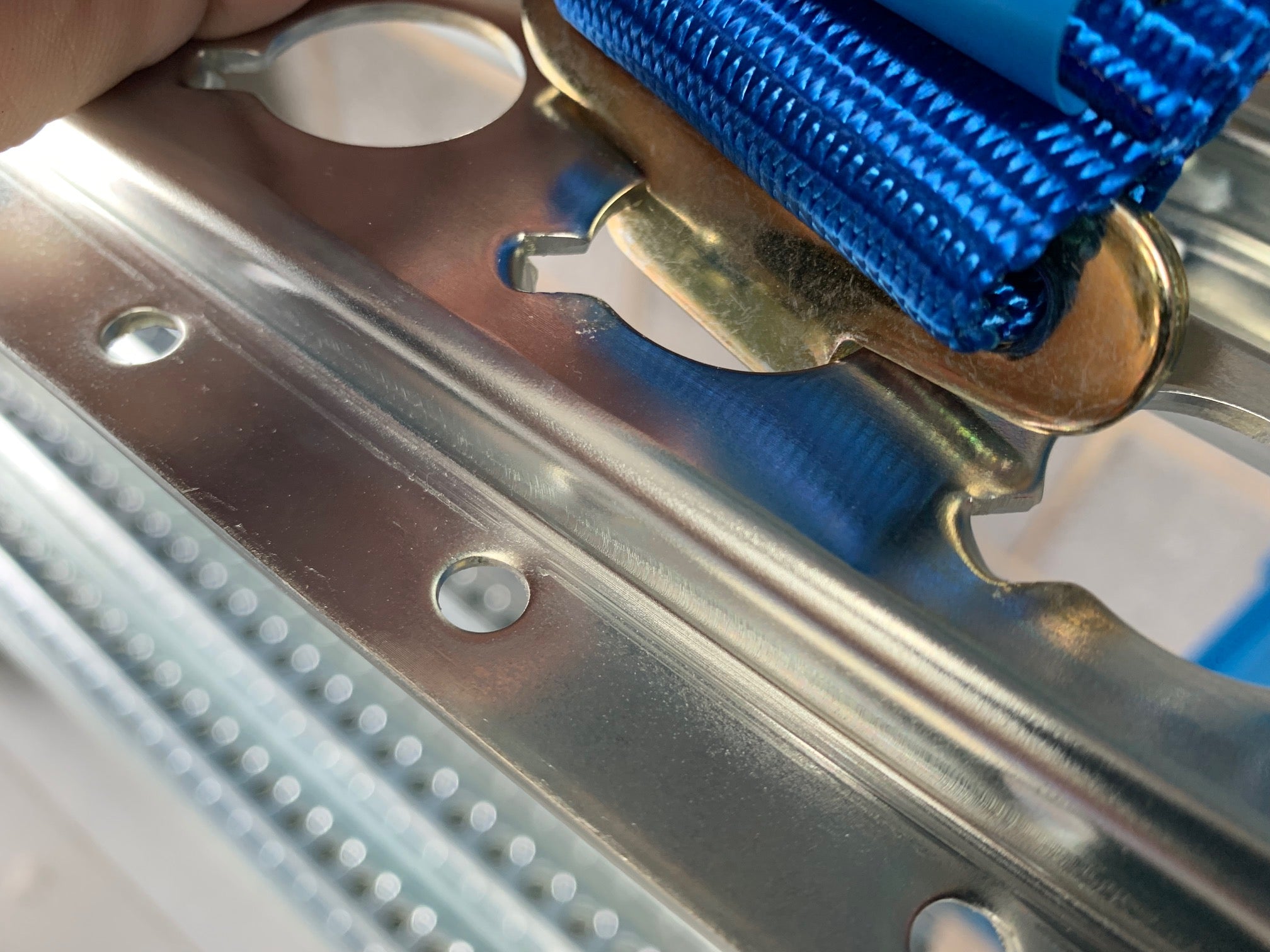 Lashing Extension for 1806 Load Track - 1200kg, blue metal strap featured, essential for securing loads in commercial vehicle interiors.