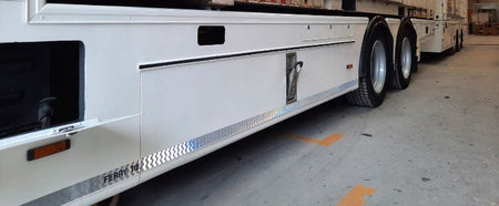 Tila Hinge 29mm x 2700mm attached to a white trailer, demonstrating its robust and maintenance-free design suitable for vehicle applications.