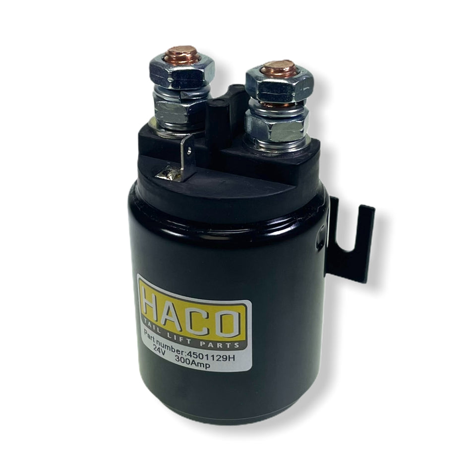 Starter Solenoid 24V 300 AMP by Haco, featuring a black cylindrical design with metal bolts and a white label. Ideal for large commercial trailers.