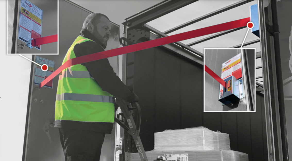 Man in safety vest demonstrating Tail Lift Stay Safe - Fall Protection system for vehicle tail lifts, enhancing safety and ease of use in commercial settings.