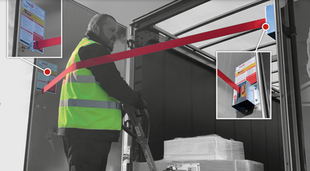 Man in safety vest demonstrating Tail Lift Stay Safe - Fall Protection system for vehicle tail lifts, enhancing safety and ease of use in commercial settings.