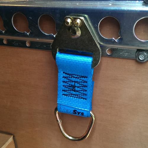 Lashing Extension for 1805 & 1806 Load Track - 2000kg on a metal surface, featuring a blue strap designed for secure vehicle load restraint.